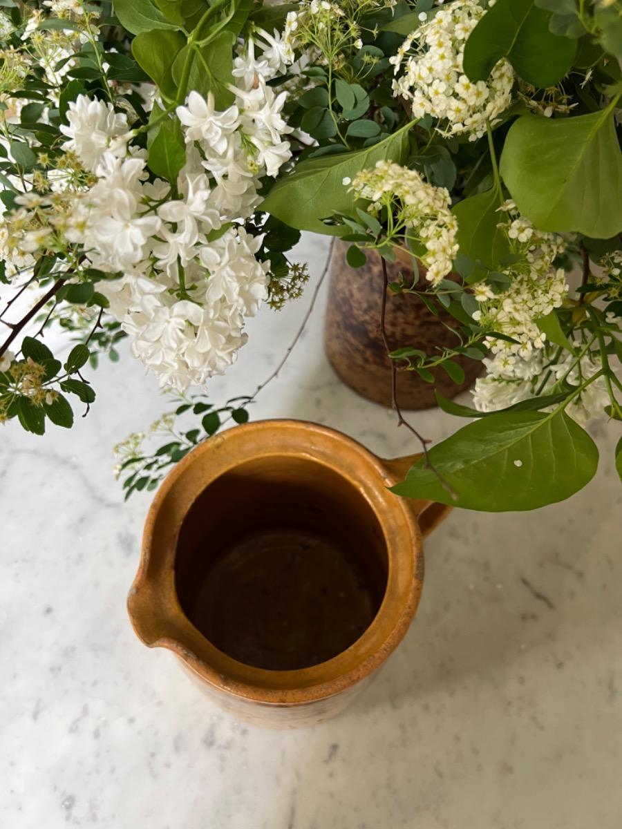 2 large earthenware pitchers